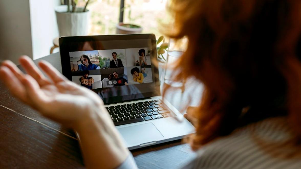 Group of students setting up professional lighting for video shoot
