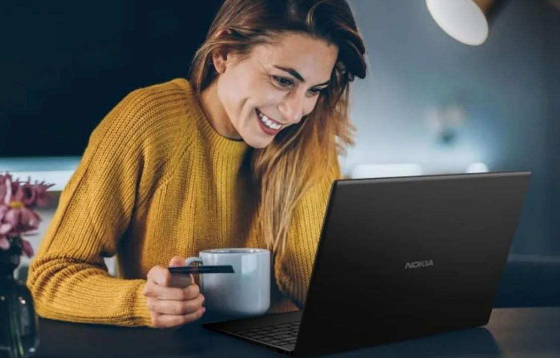 Instructor reviewing footage with student at editing station